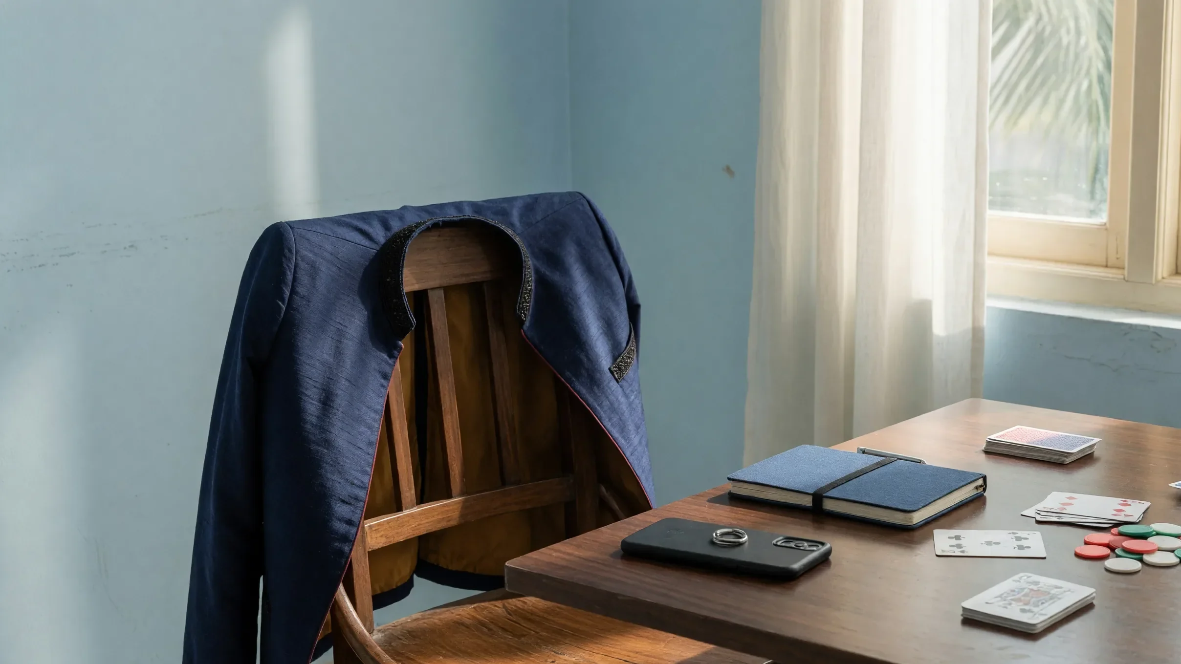 Empty return seat, facedown phone and a jacket on a chair